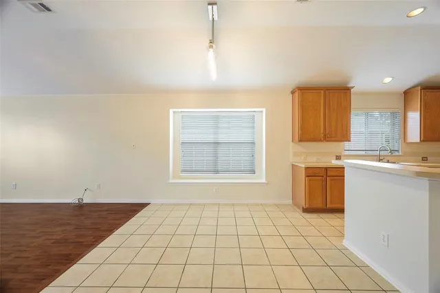 a view of a kitchen with a sink and a stove top oven