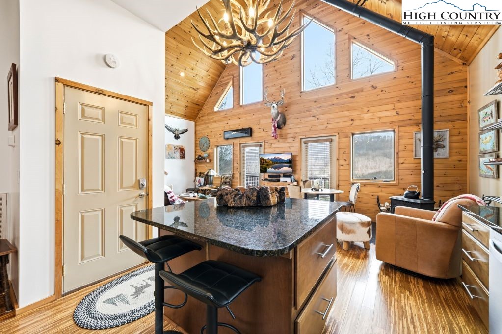 408 Eagle Ridge Road Roan Mountain, TN 37687 - Photo 6 of 45 a dining room with wooden floor and large windows