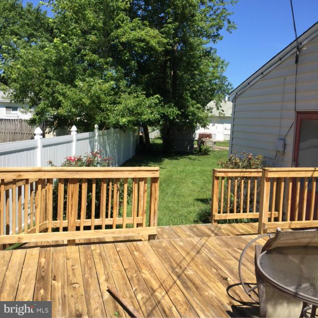 6224 Auth Road Suitland, MD 20746 - Photo 3 of 14 a view of a deck with two chairs and a table