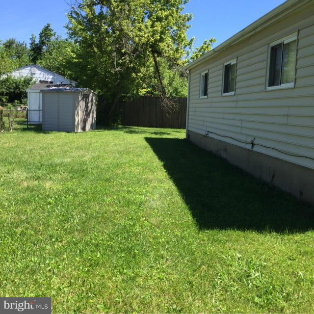 6224 Auth Road Suitland, MD 20746 - Photo 5 of 14 a view of a backyard with a garden