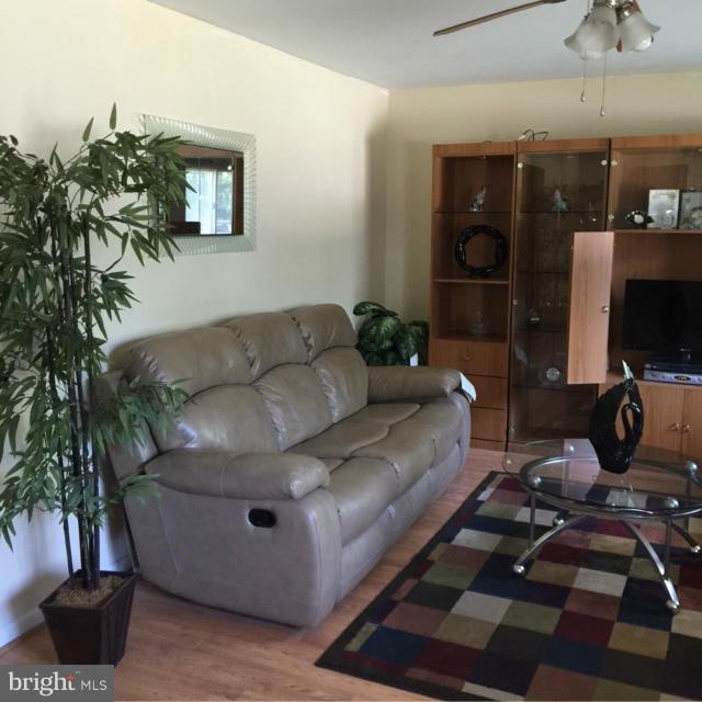 6224 Auth Road Suitland, MD 20746 - Photo 8 of 14 a living room with furniture and a flat screen tv