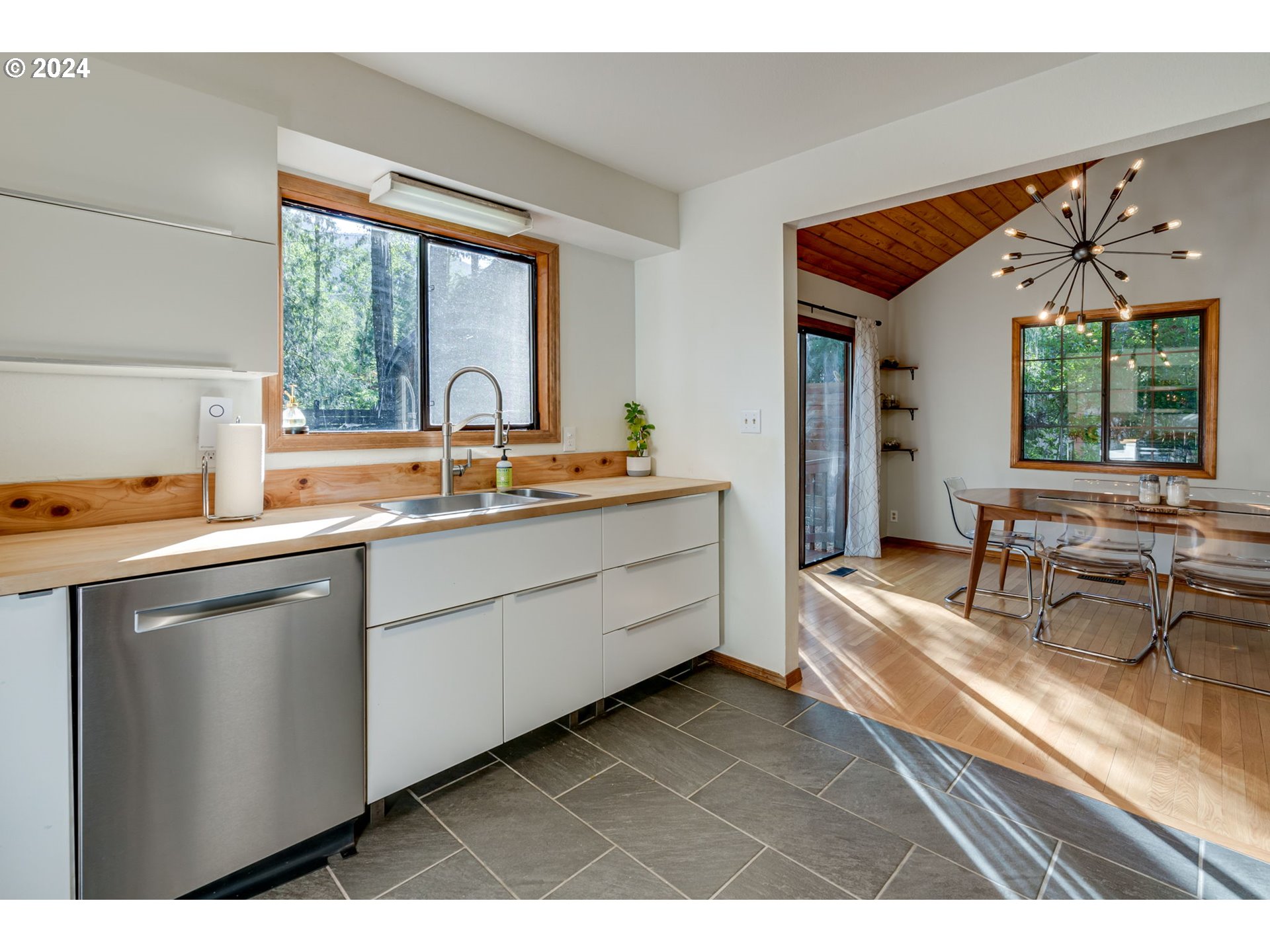 65377 East Sandy River Lane Rhododendron, OR 97049 - Photo 11 of 40 a kitchen with a sink and large window