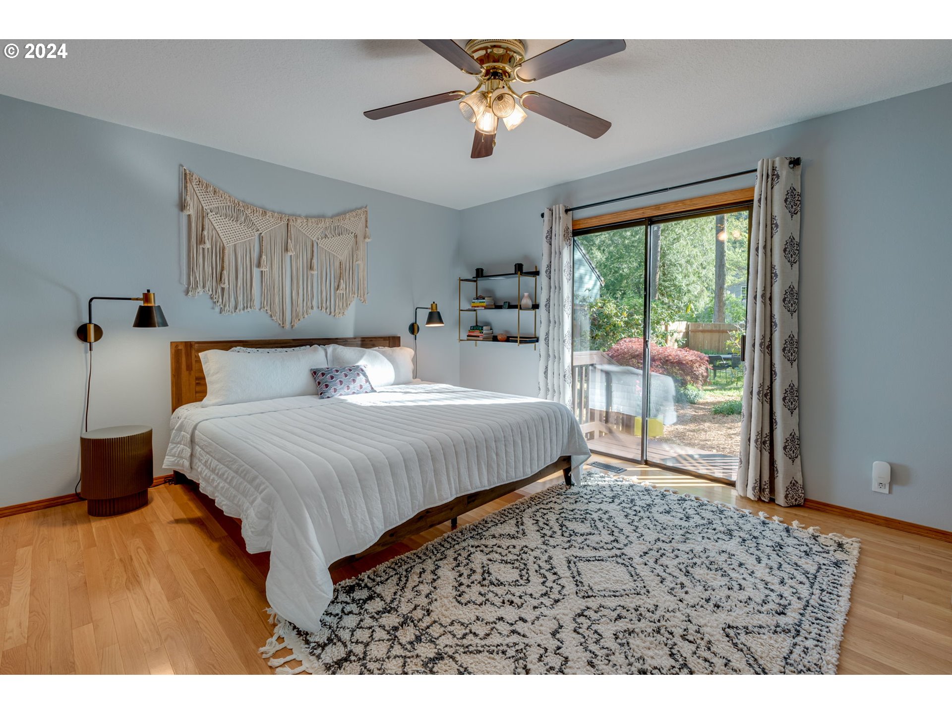 65377 East Sandy River Lane Rhododendron, OR 97049 - Photo 13 of 40 a bedroom with a balcony a bed and a table