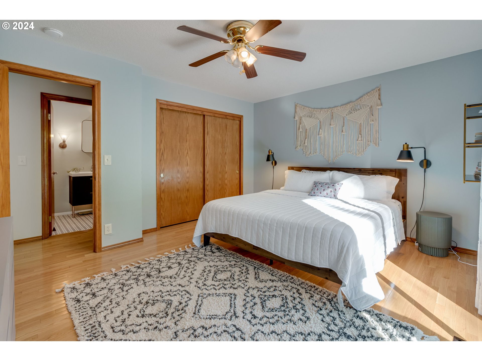 65377 East Sandy River Lane Rhododendron, OR 97049 - Photo 14 of 40 a bedroom with a bed and a chandelier