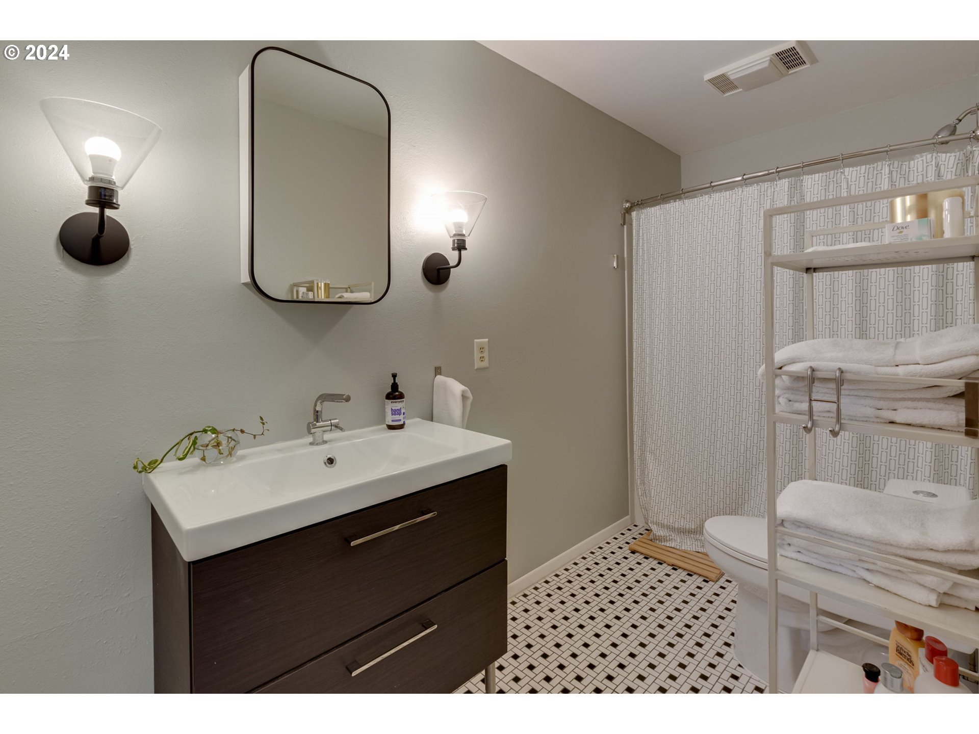 65377 East Sandy River Lane Rhododendron, OR 97049 - Photo 15 of 40 a bathroom with a sink and a mirror