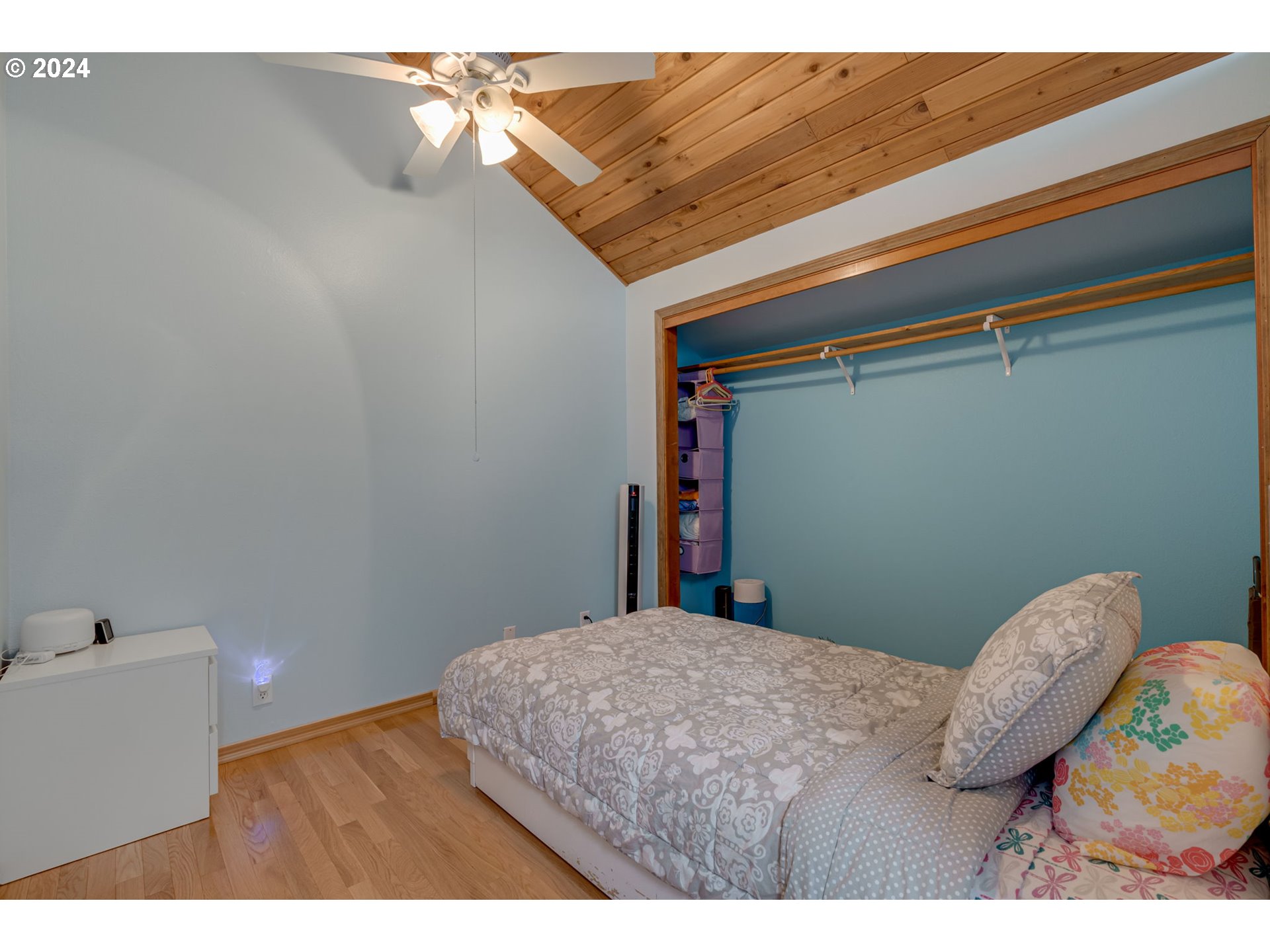 65377 East Sandy River Lane Rhododendron, OR 97049 - Photo 23 of 40 a bedroom with a bed and a wall painting