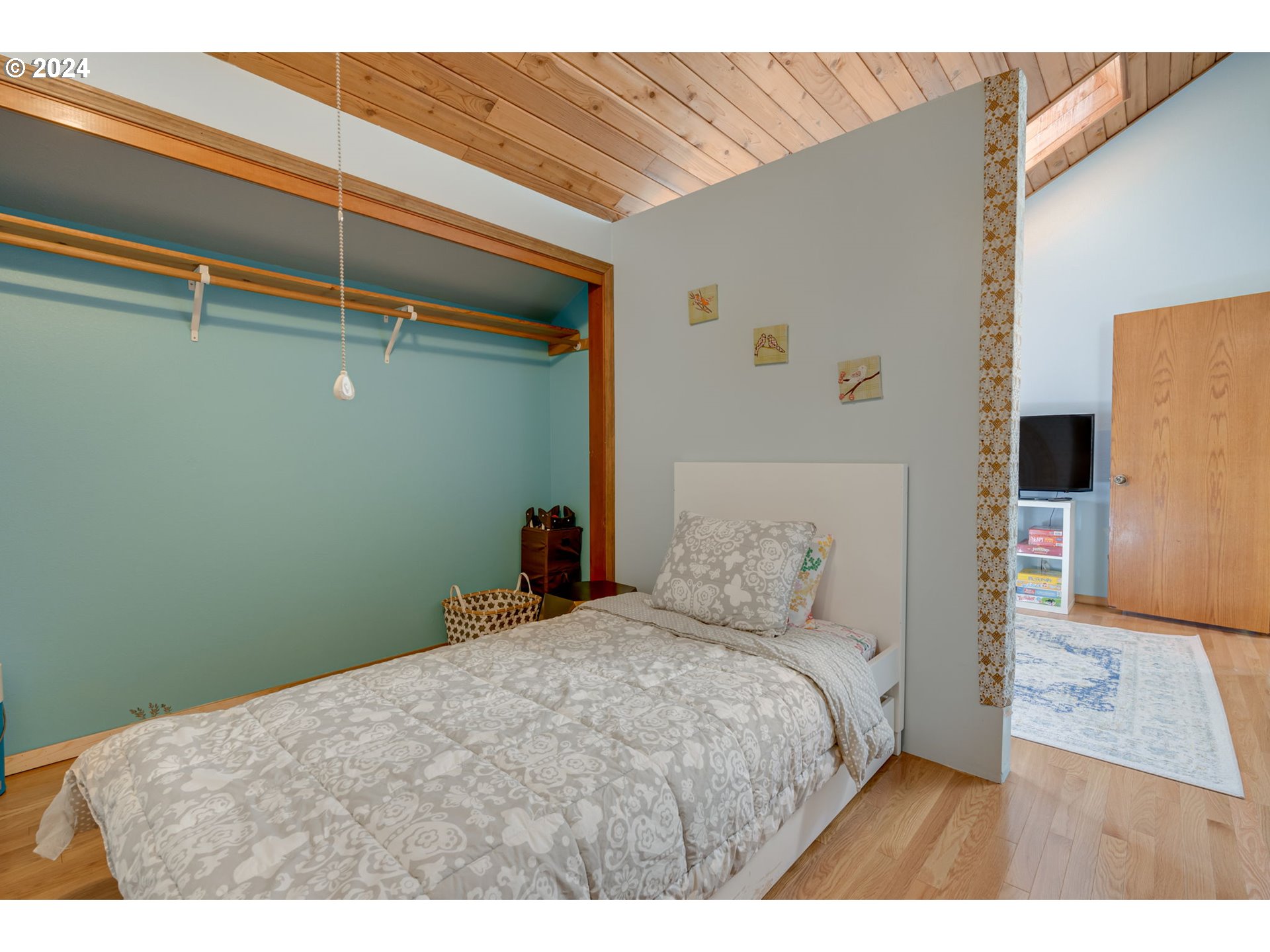 65377 East Sandy River Lane Rhododendron, OR 97049 - Photo 24 of 40 a bedroom with a bed and a wall painting