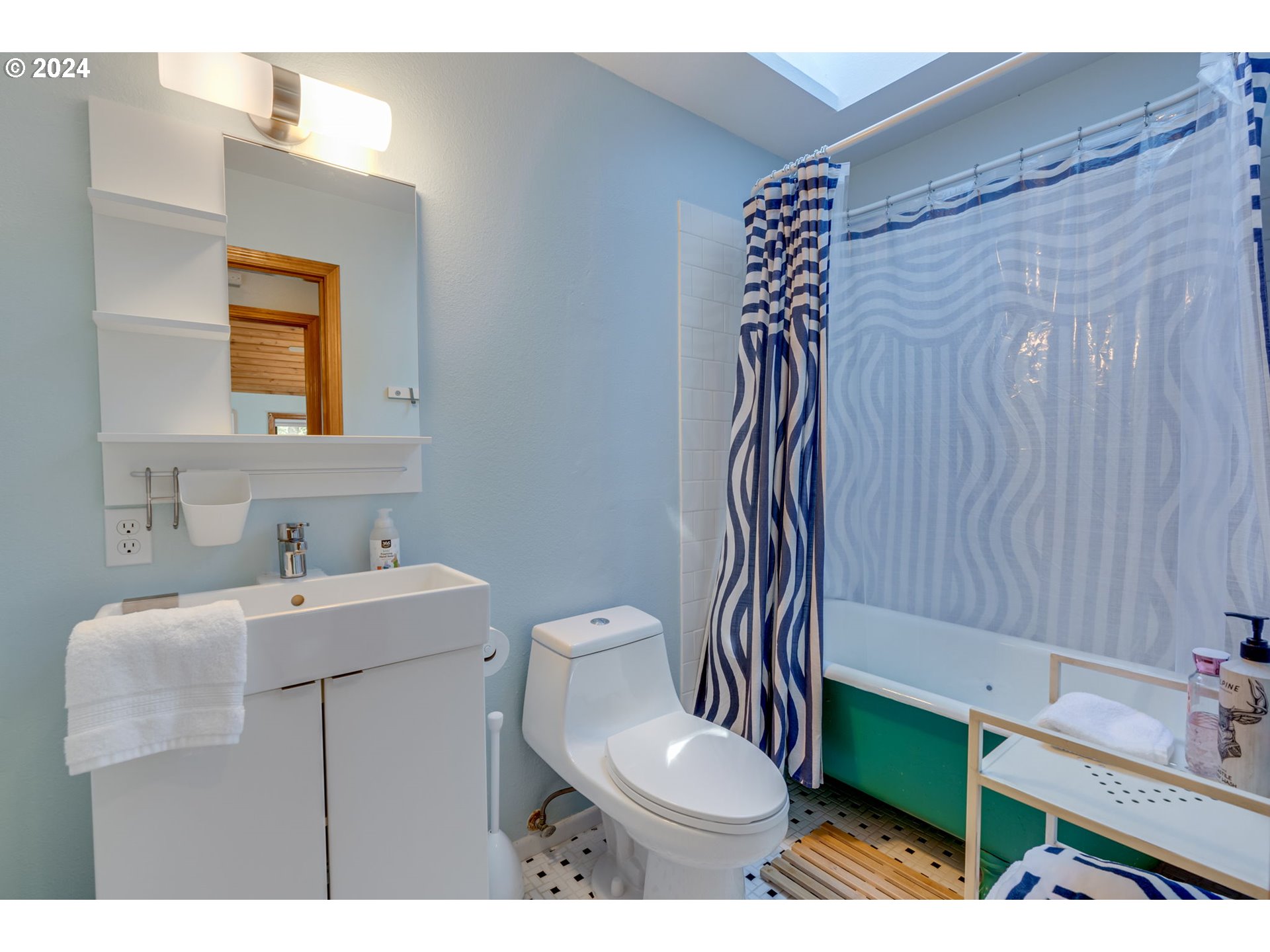 65377 East Sandy River Lane Rhododendron, OR 97049 - Photo 25 of 40 a bathroom with a sink toilet and mirror