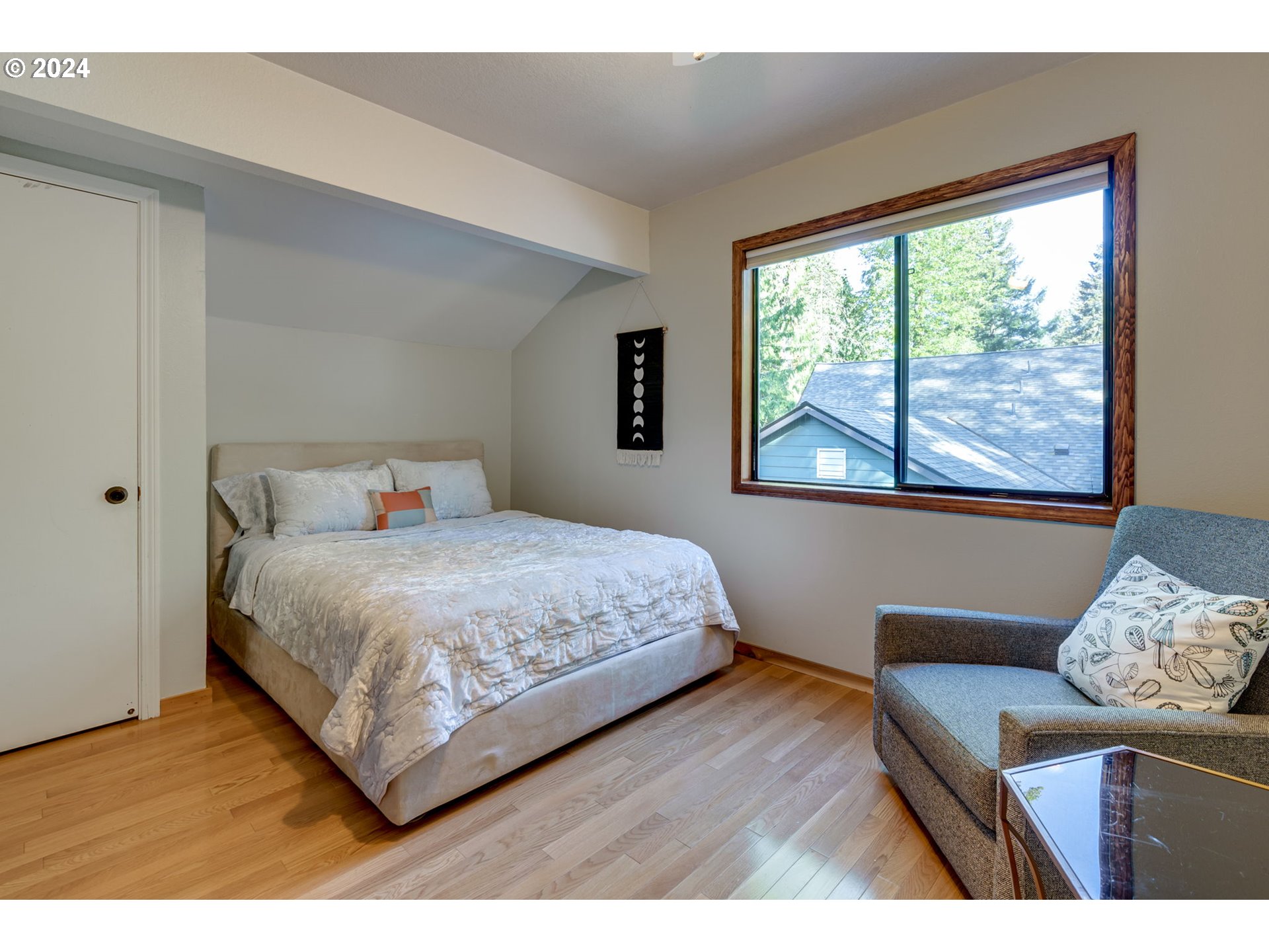 65377 East Sandy River Lane Rhododendron, OR 97049 - Photo 26 of 40 a bedroom with a bed and wooden floor