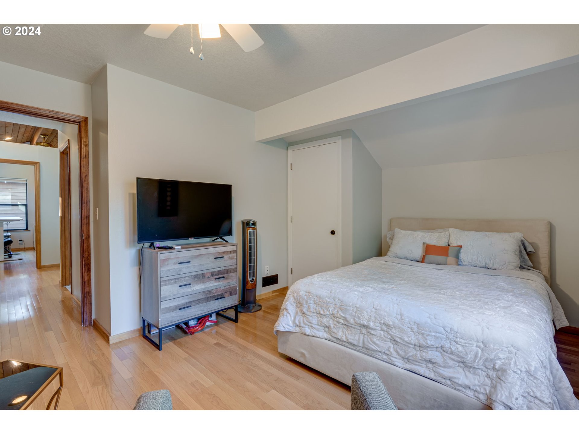 65377 East Sandy River Lane Rhododendron, OR 97049 - Photo 28 of 40 a bedroom with a bed and a flat screen tv