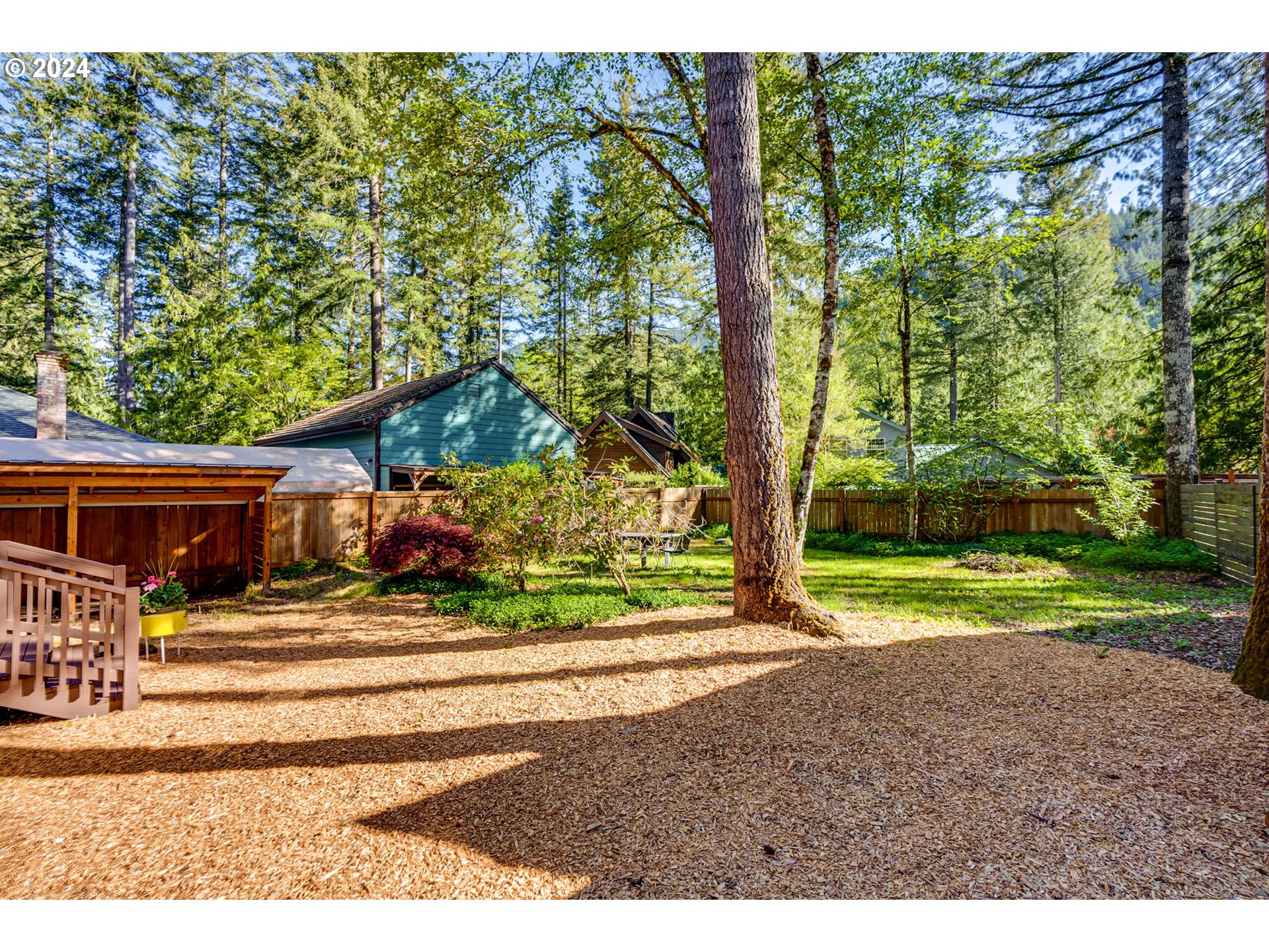 65377 East Sandy River Lane Rhododendron, OR 97049 - Photo 30 of 40 a backyard of a house with barbeque oven