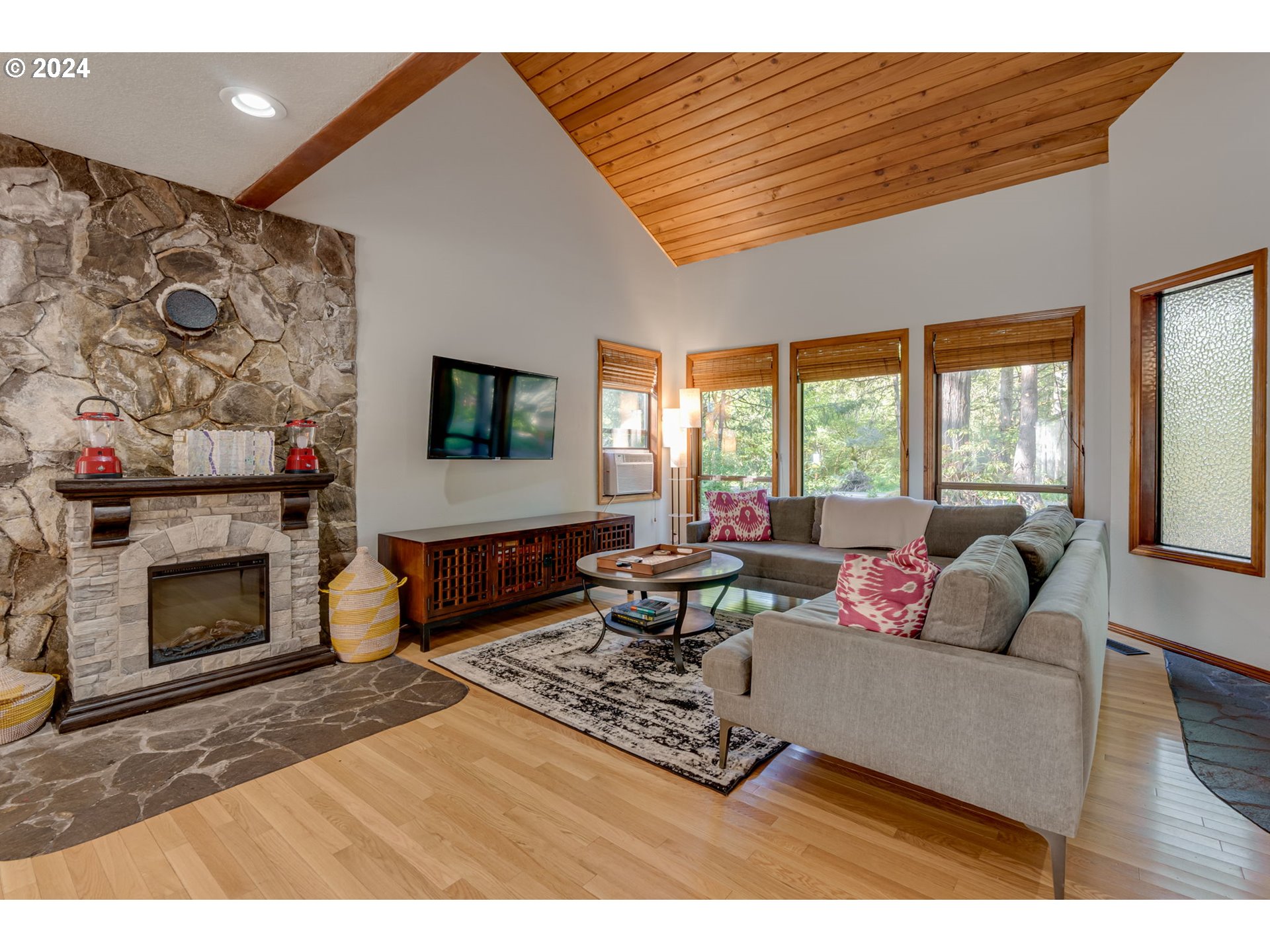 65377 East Sandy River Lane Rhododendron, OR 97049 - Photo 3 of 40 a living room with furniture and a fireplace