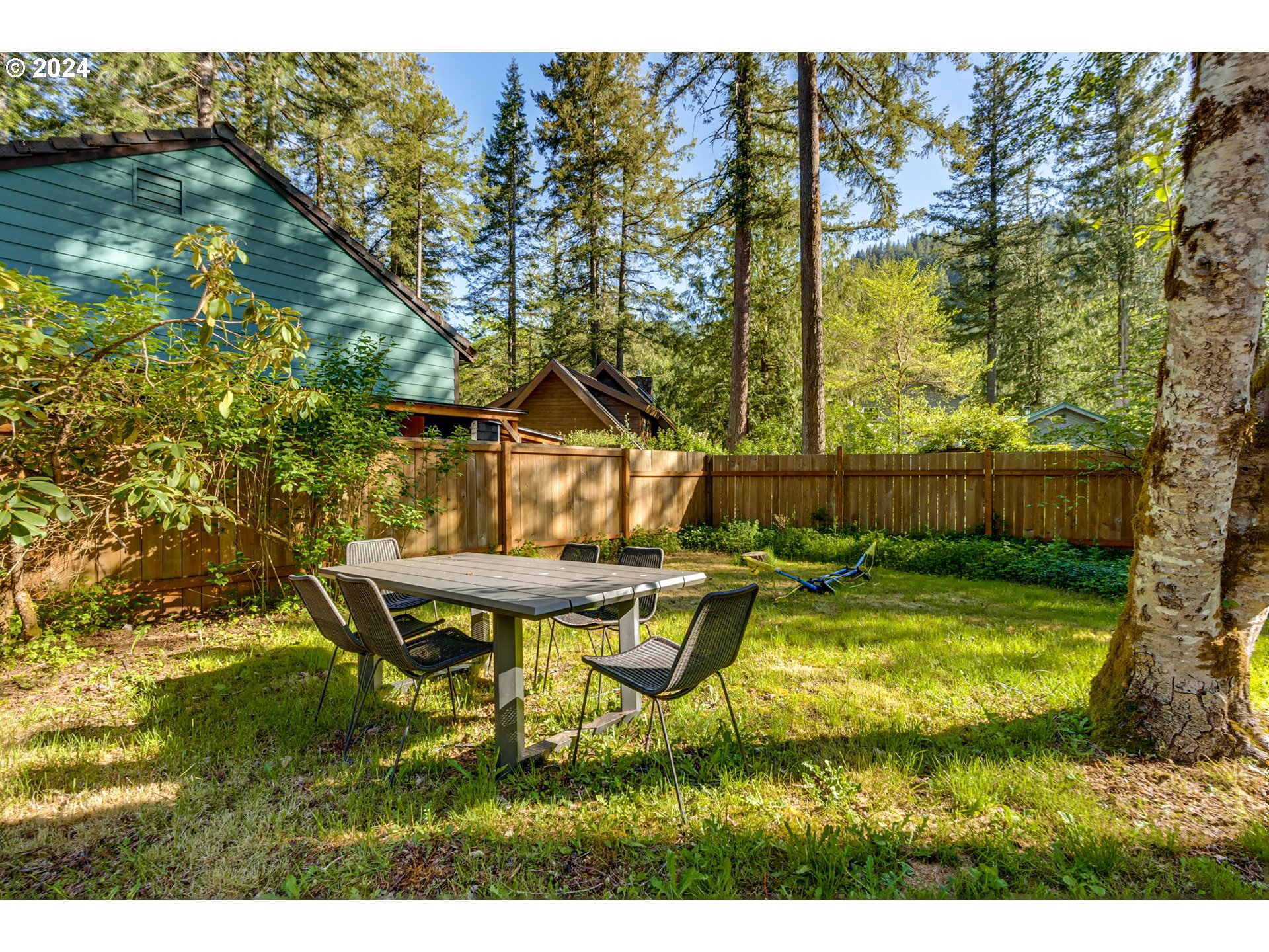 65377 East Sandy River Lane Rhododendron, OR 97049 - Photo 33 of 40 a view of swimming pool with lawn chairs and plants