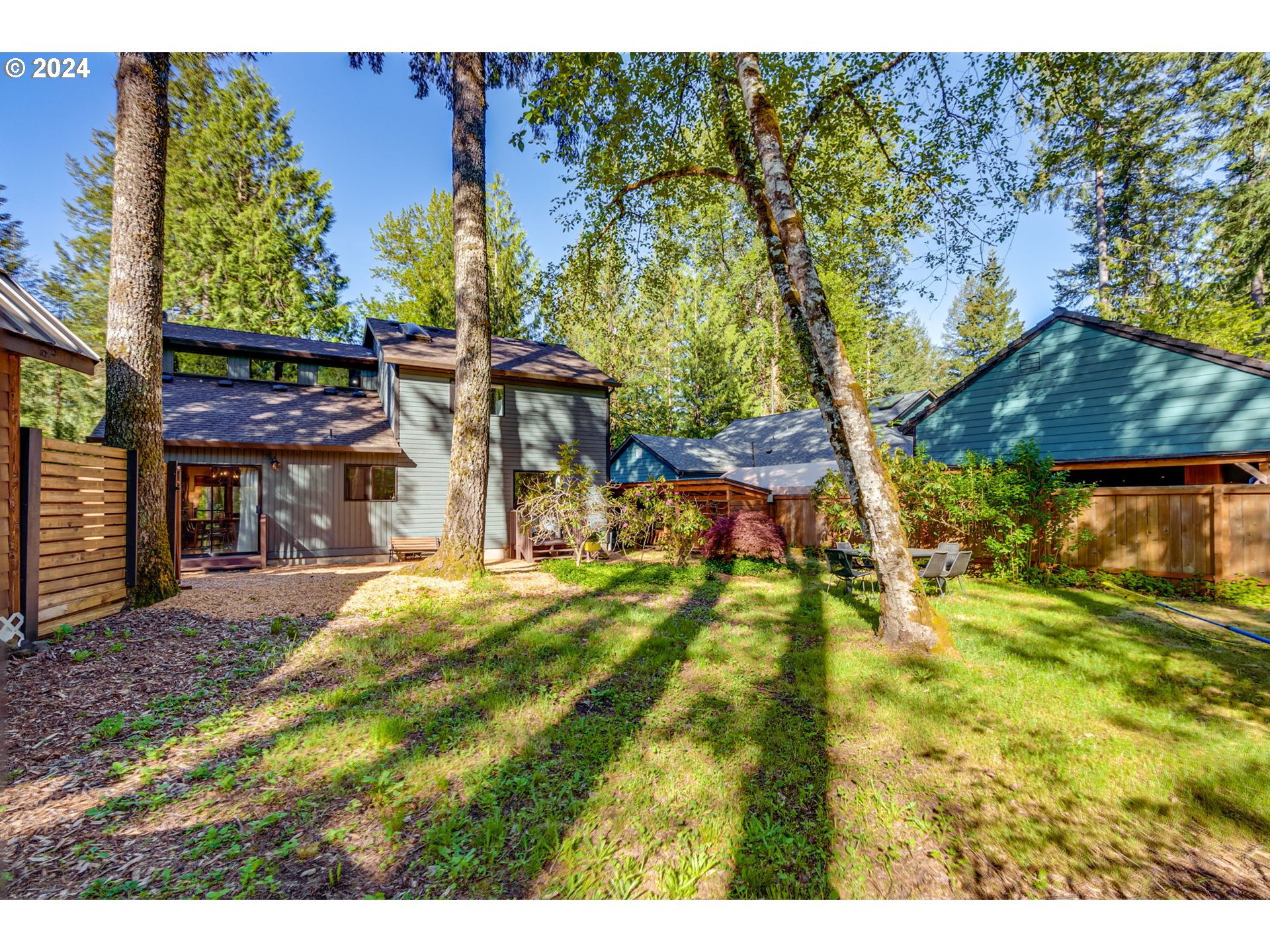 65377 East Sandy River Lane Rhododendron, OR 97049 - Photo 35 of 40 a view of a house with a yard