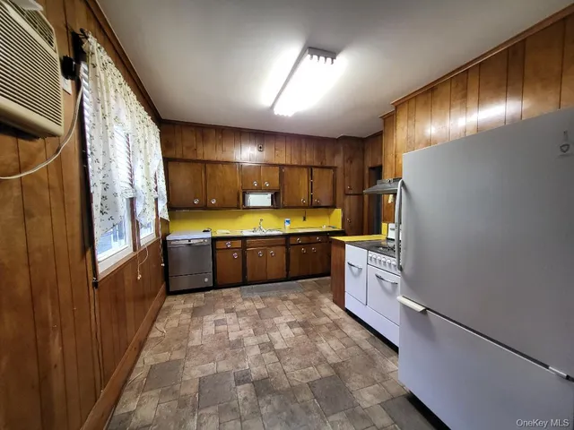 a large kitchen with a large window