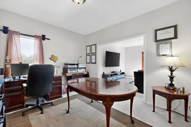 a view of a workspace with furniture