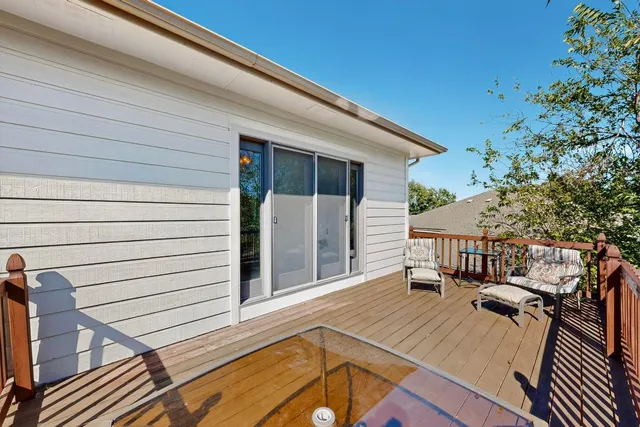 a view of a balcony with chairs