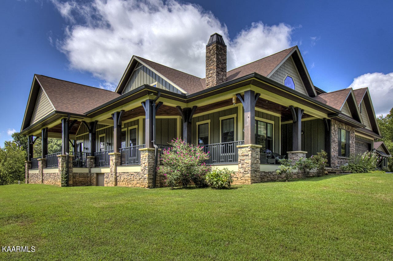 215 Estes Road Loudon, TN 37774 - Photo 2 of 59 a front view of a house with garden