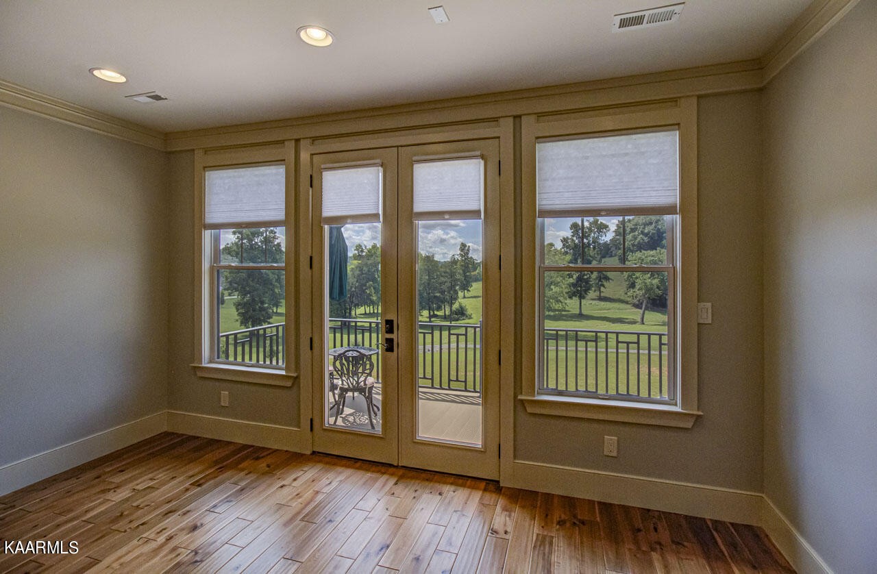 215 Estes Road Loudon, TN 37774 - Photo 30 of 59 a view of an empty room with wooden floor and a window