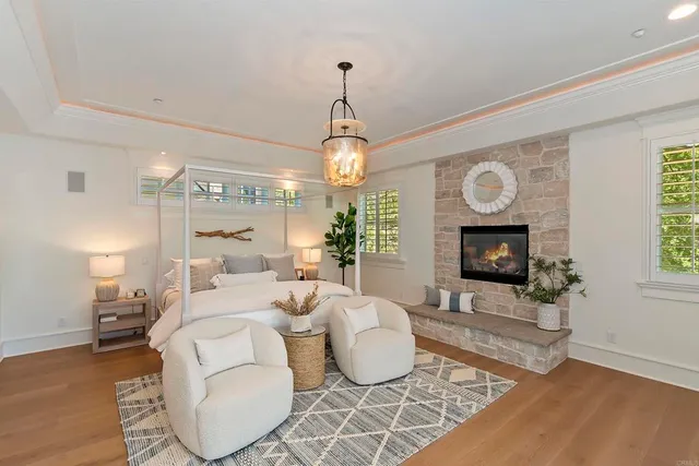 a bedroom with a bed and a painting on the wall