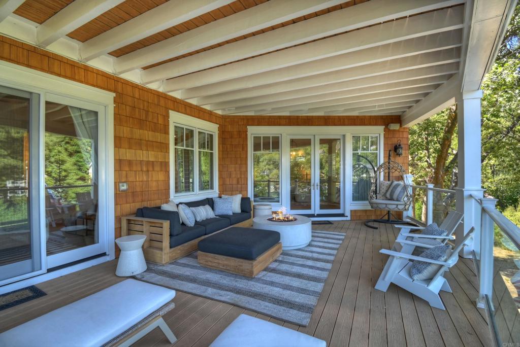 27567 West Shore Road Lake Arrowhead, CA 92352 - Photo 36 of 62 a living room with furniture and large windows