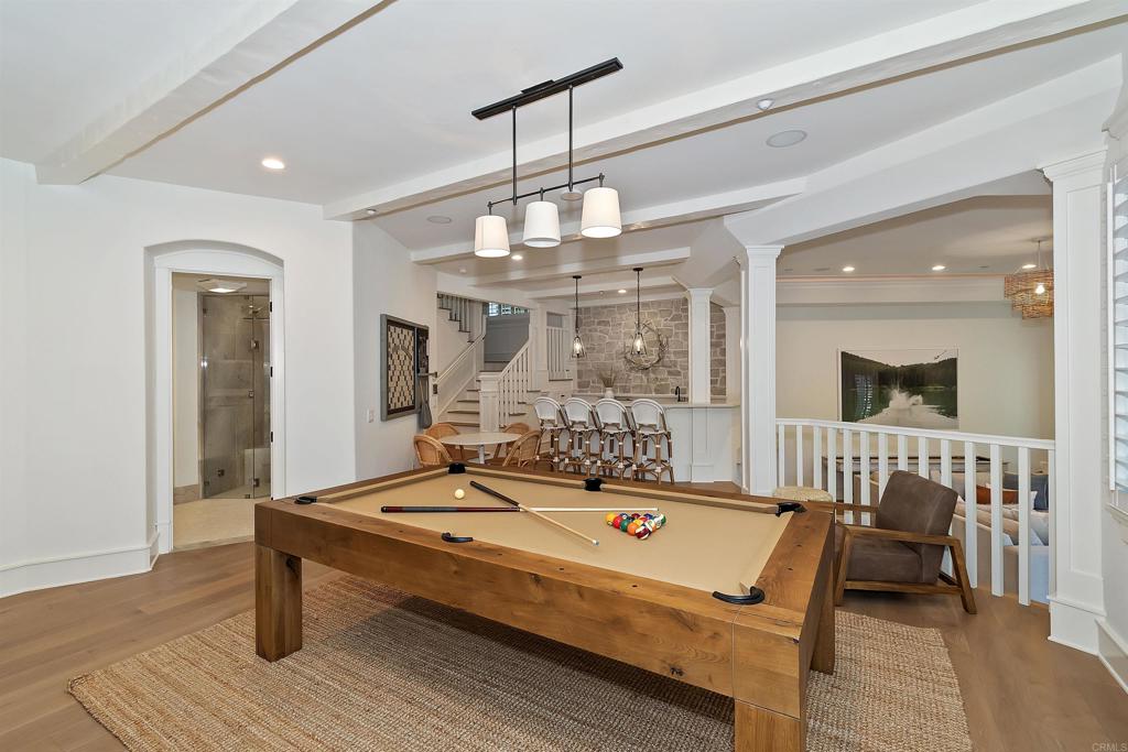 27567 West Shore Road Lake Arrowhead, CA 92352 - Photo 46 of 62 a living room with a table chairs and a chandelier