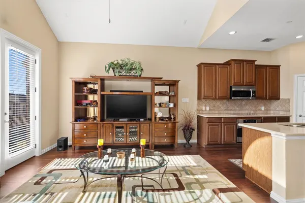 a kitchen with stainless steel appliances a sink and a refrigerator
