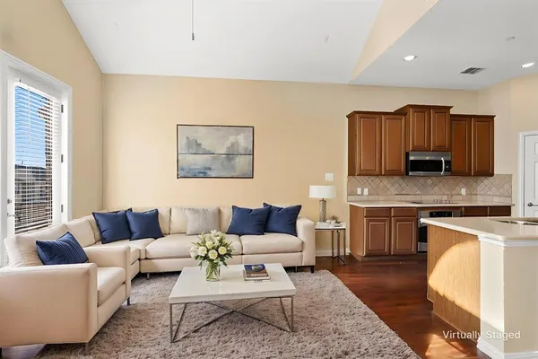 a bedroom with a bed and a couch