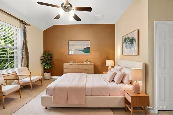 a kitchen with stainless steel appliances kitchen island granite countertop a table chairs and a stove