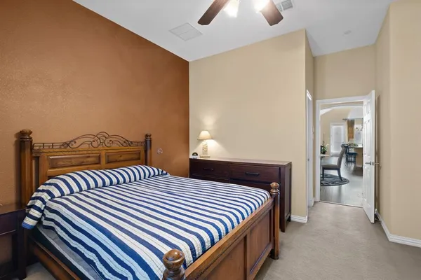 a kitchen with stainless steel appliances granite countertop a stove top oven a refrigerator a sink dishwasher with a dining table and chairs with wooden floor