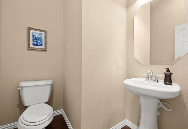 a living room with furniture a flat screen tv and a large window