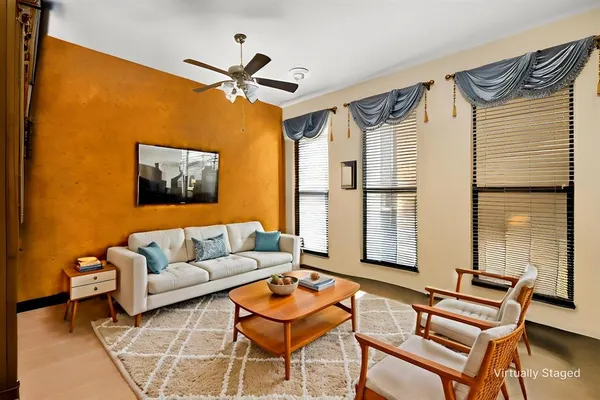 a living room with furniture and a window