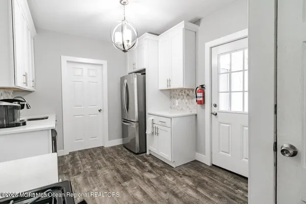 a kitchen with a stove and a microwave