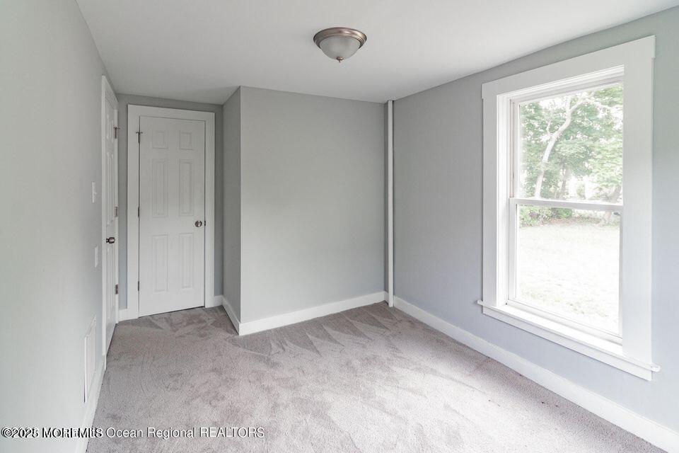 306 Henley Avenue, Unit A Pine Beach, NJ 08741 - Photo 14 of 16 a view of an empty room with a window