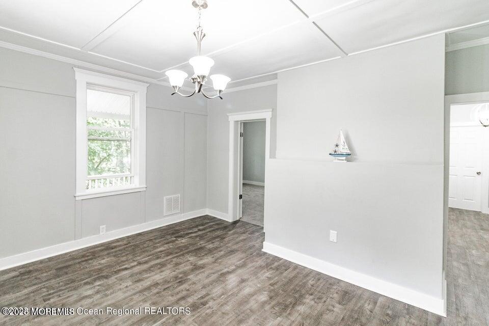 306 Henley Avenue, Unit A Pine Beach, NJ 08741 - Photo 4 of 16 a view of a chandelier in a room with a window