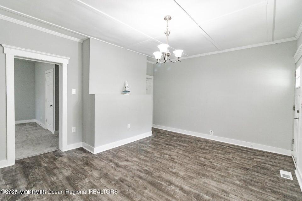306 Henley Avenue, Unit A Pine Beach, NJ 08741 - Photo 5 of 16 wooden floor in an empty room with a window