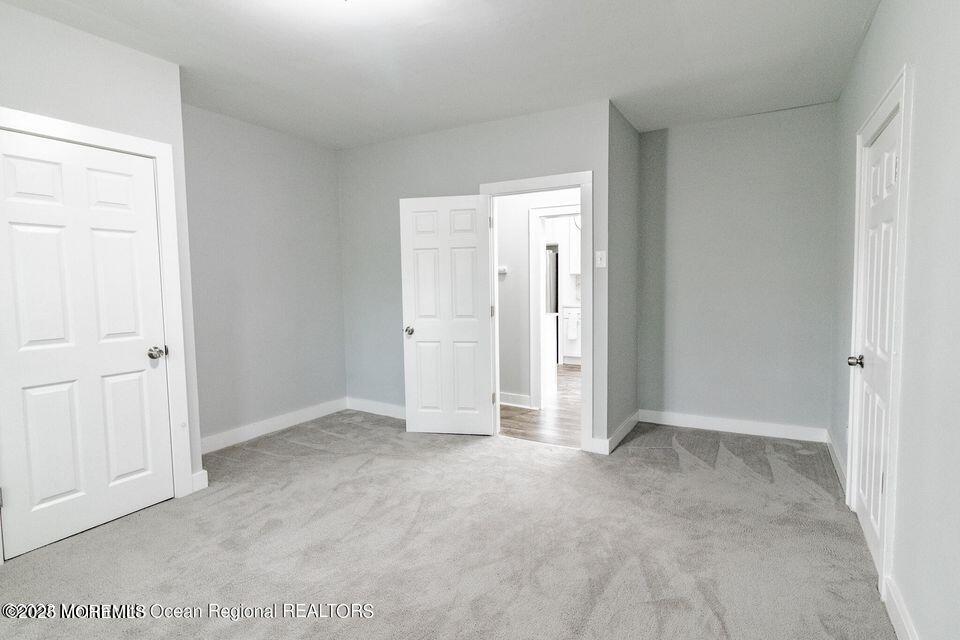 306 Henley Avenue, Unit A Pine Beach, NJ 08741 - Photo 6 of 16 an empty room with closet area