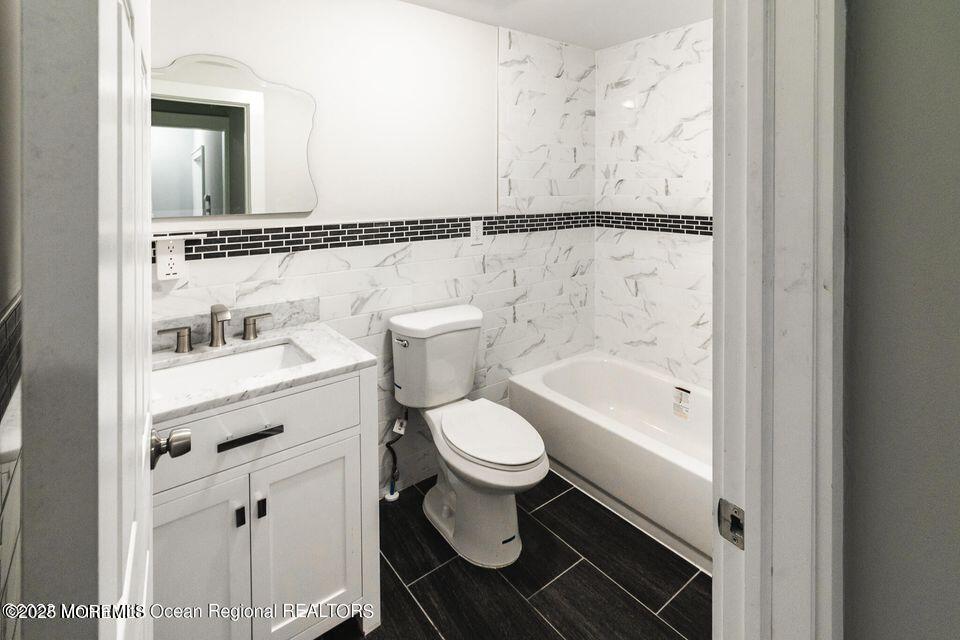 306 Henley Avenue, Unit A Pine Beach, NJ 08741 - Photo 9 of 16 a bathroom with a sink toilet and shower