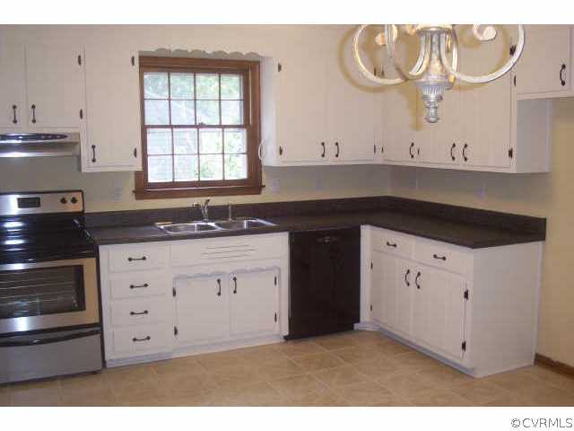 15712 Saddlebrook Road Chesterfield, VA 23838 - Photo 6 of 7 a kitchen with white cabinets and sink