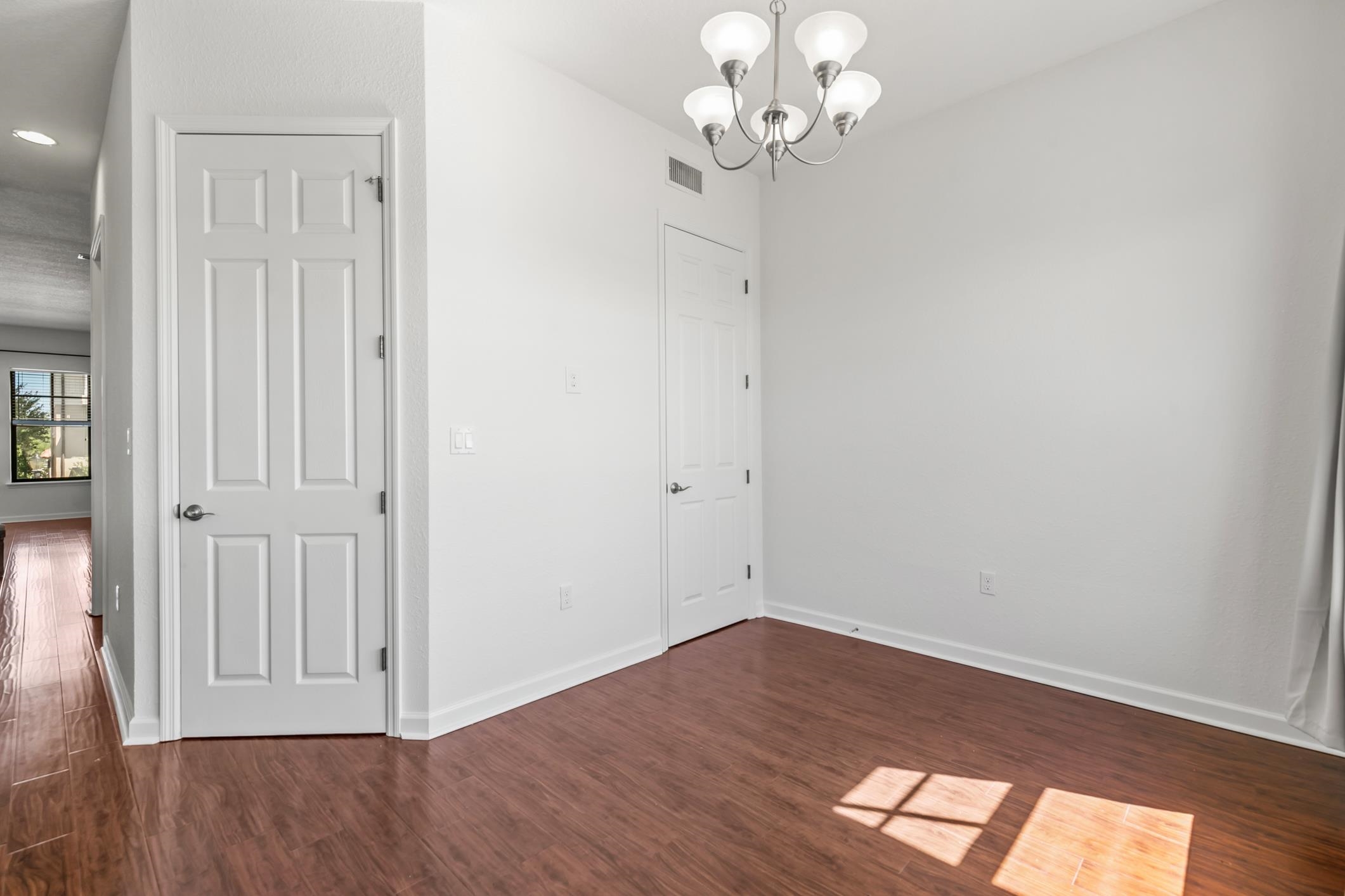 654 Market Street St. Augustine, FL 32095 - Photo 12 of 38 wooden floor in an empty room with a window