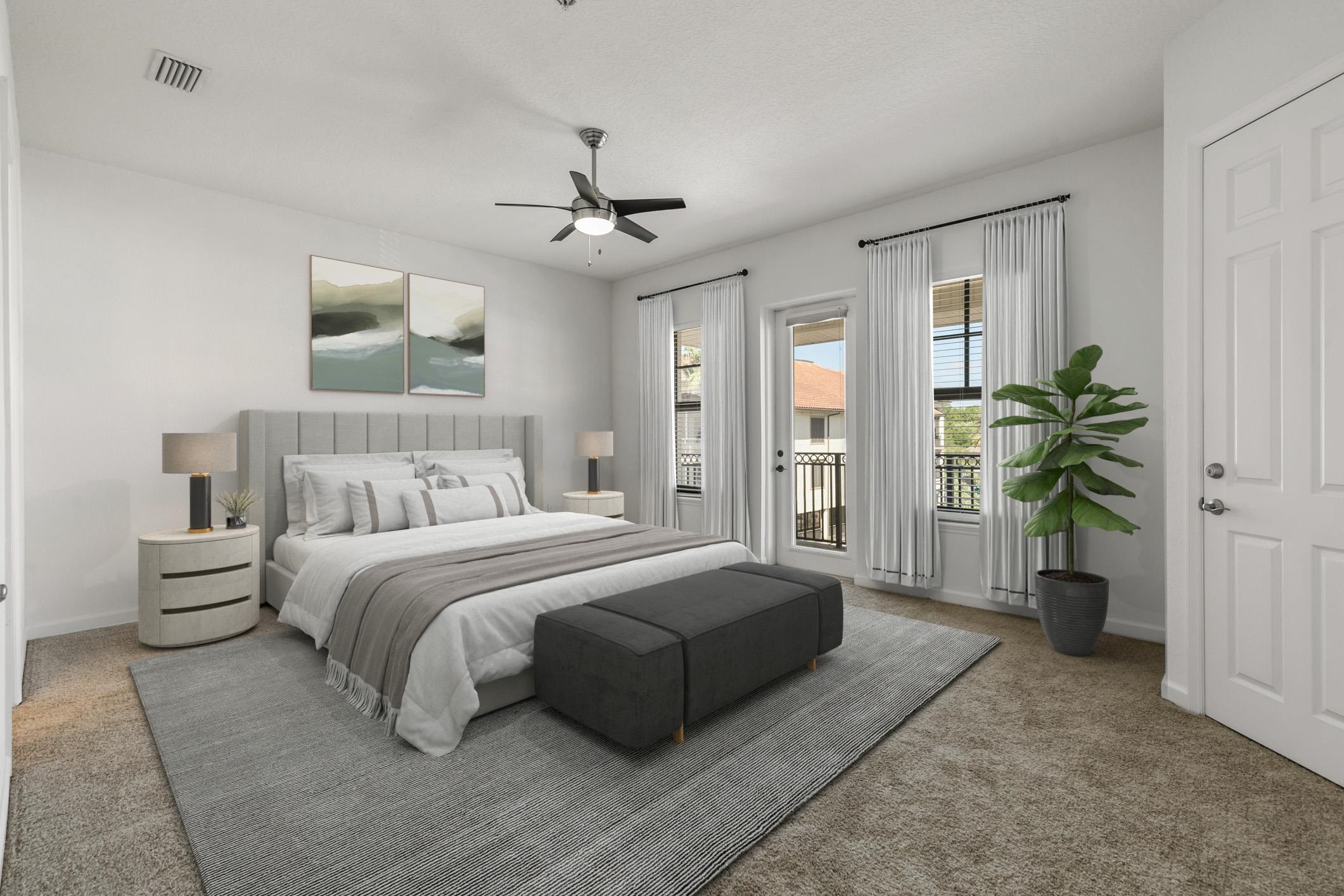 654 Market Street St. Augustine, FL 32095 - Photo 17 of 38 a spacious bedroom with a large bed and a chandelier
