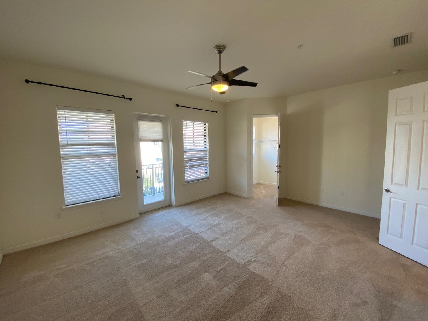 654 Market Street St. Augustine, FL 32095 - Photo 18 of 38 an empty room with chandelier fan and windows