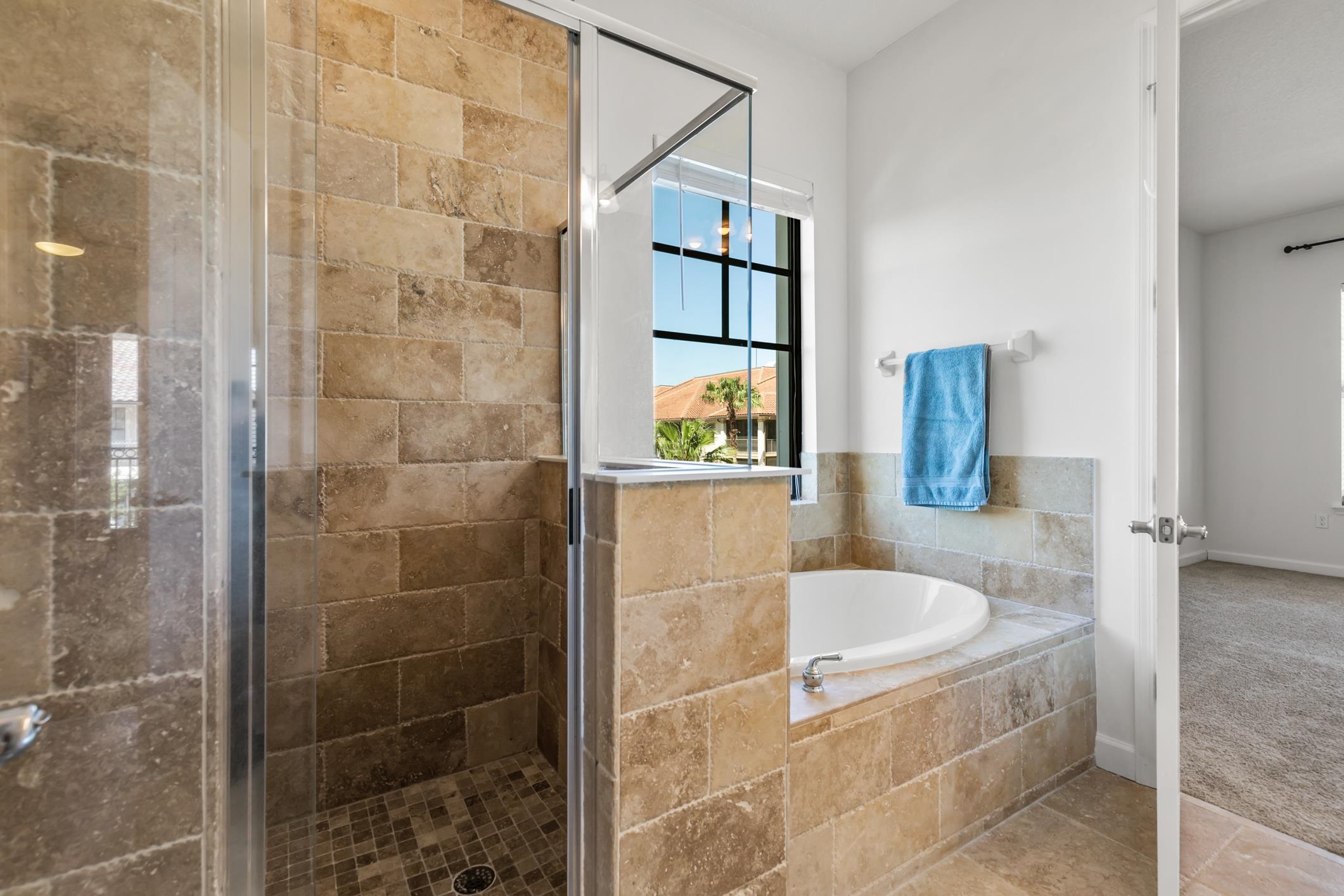654 Market Street St. Augustine, FL 32095 - Photo 23 of 38 a bathroom with a bathtub and shower