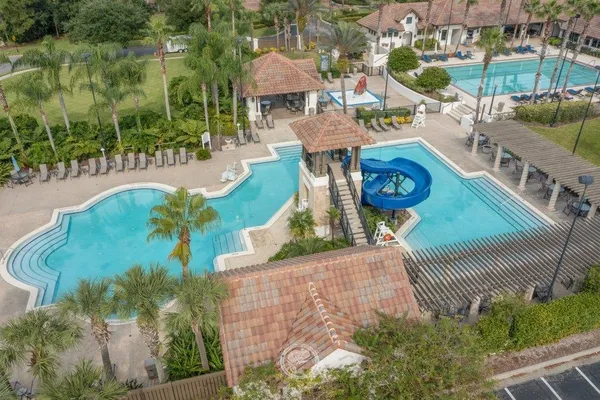 an aerial view of a house with outdoor space