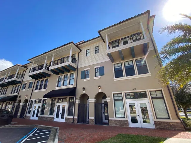 a front view of a building with grey walls