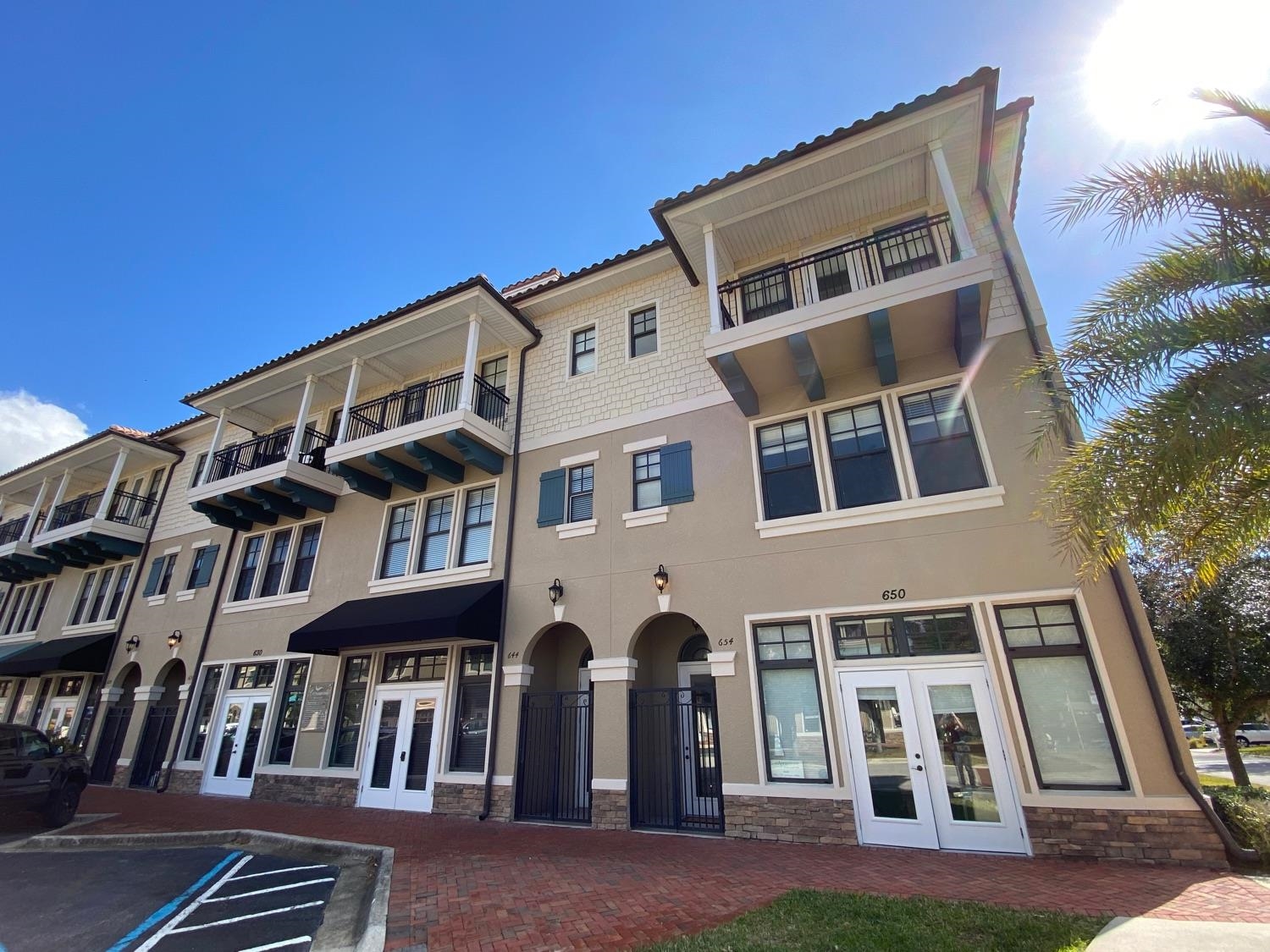 654 Market Street St. Augustine, FL 32095 - Photo 3 of 38 a front view of a building with grey walls