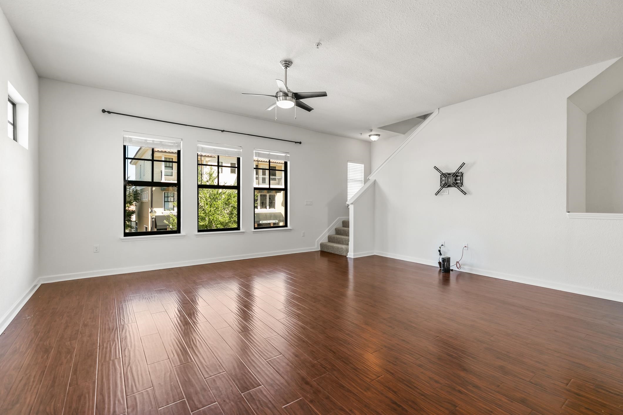 654 Market Street St. Augustine, FL 32095 - Photo 4 of 38 an empty room with wooden floor and windows
