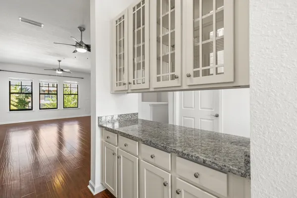 a view of a kitchen cabinets and a counter top space