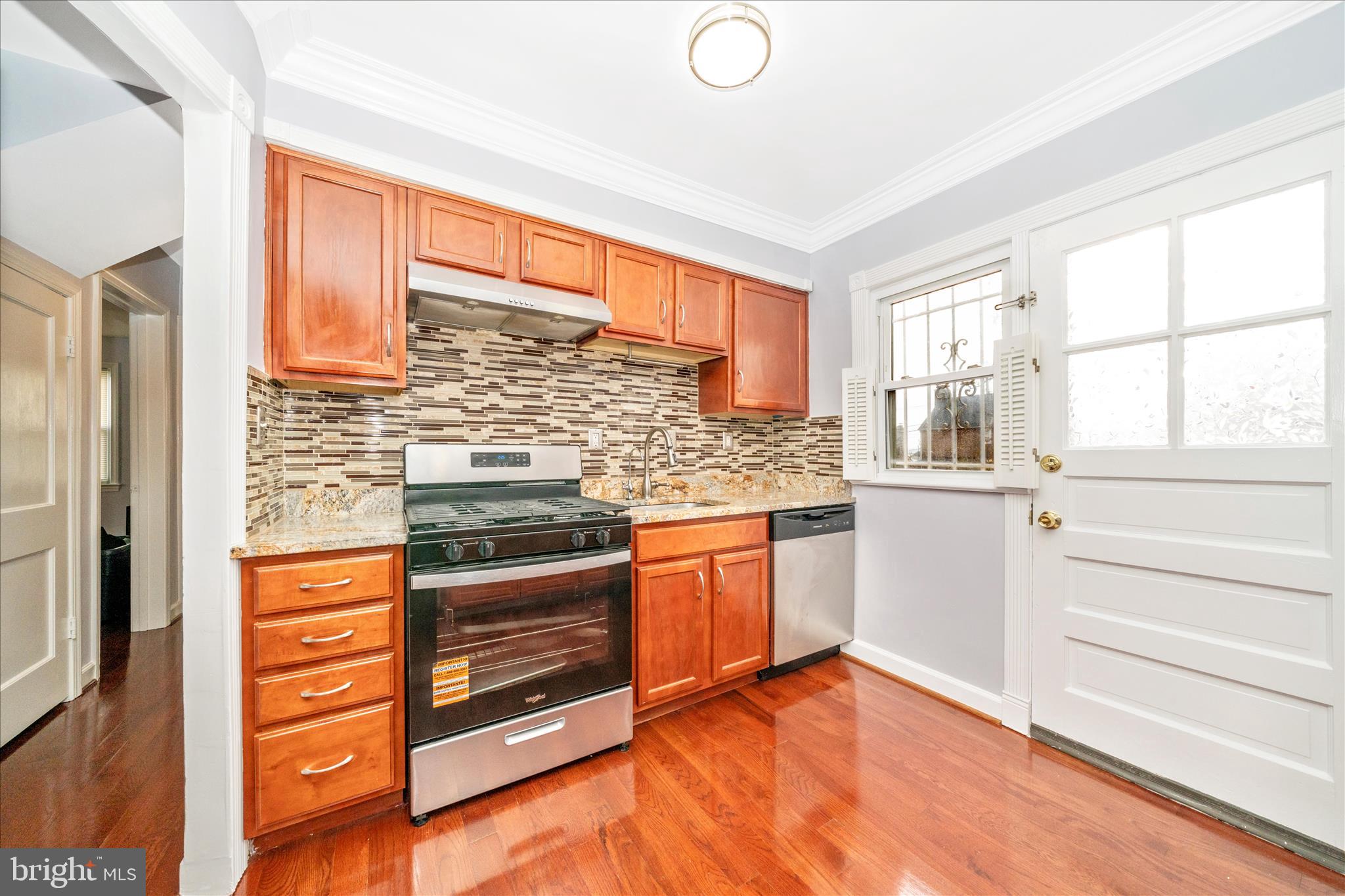 821 Rittenhouse Street Hyattsville, MD 20783 - Photo 13 of 59 a kitchen with stainless steel appliances granite countertop a stove and more cabinets