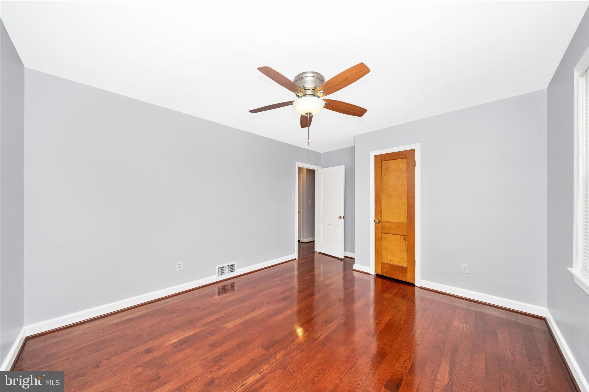 821 Rittenhouse Street Hyattsville, MD 20783 - Photo 21 of 59 a view of an empty room with window and wooden floor